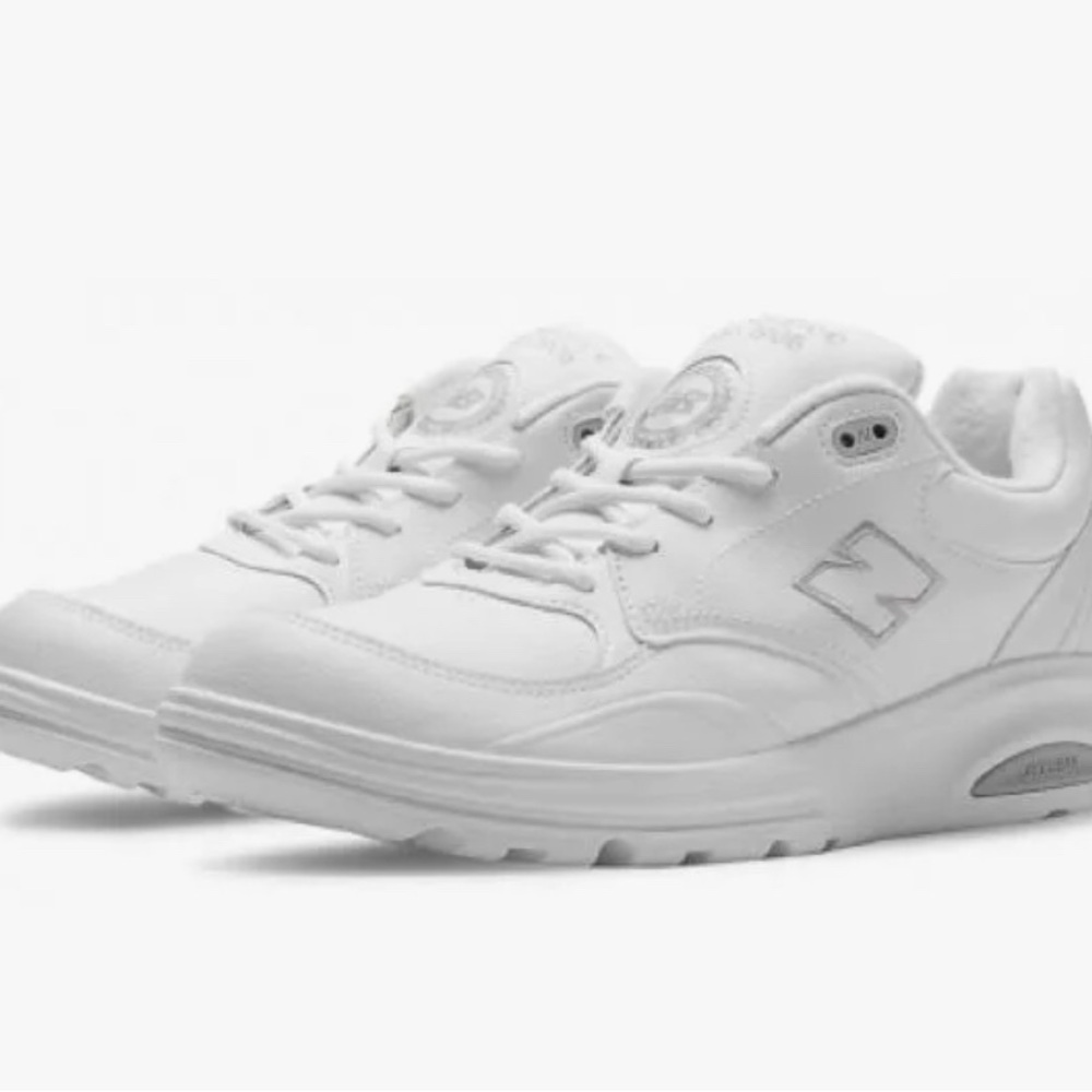 New Balance lightly worn white leather 812 walking shoe.